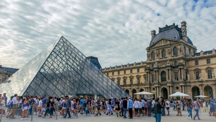 a large group of people standing in front of a building