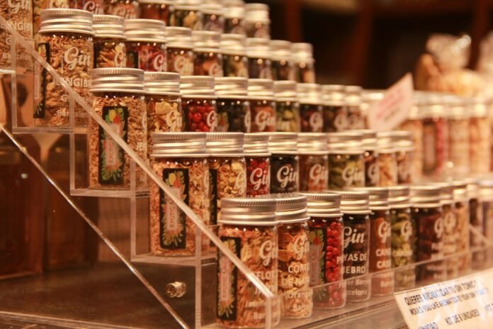 Rows of small glass jars filled with spices.